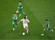 19 June 2023; Tjay De Barr of Gibraltar tries to get away from Republic of Ireland players, Josh Cullen, right, Alan Browne and Dara O'Shea, behind during the UEFA EURO 2024 Championship qualifying group B match between Republic of Ireland and Gibraltar at the Aviva Stadium in Dublin. Photo by Piaras Ó Mídheach/Sportsfile
