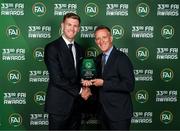 20 June 2023; Nathan Collins is presented with the Men’s Senior Player of the Year award by FAI Chief Executive Officer Jonathan Hill during the FAI 33rd International Awards media event at Mansion House in Dublin. Photo by Stephen McCarthy/Sportsfile