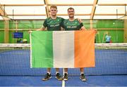 22 June 2023; Sean Neave of Ireland, left, and teammate Sam McKibbin pose for a photograph with the tricolour after winning the men's double Padel qualification round match between Ireland and Albania during the European Games at the KSOS in Krakow. Photo by Tyler Miller/Sportsfile