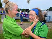 22 June 2023; Team Ireland's Michelle O'Keane, a member of Galway Kayaking, from Galway, Galway, cherishes the moment after she had been presented with a Silver Medal after the KT-1200m Woman F03 division by Karen Coventry, left, Director of Sport, Special Olympics Ireland during the Kayaking Finals on day six of the World Special Olympic Games 2023 at the Grünau regatta course in Berlin, Germany. Photo by Ray McManus/Sportsfile
