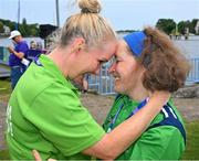 22 June 2023; Team Ireland's Michelle O'Keane, a member of Galway Kayaking, from Galway, Galway, cherishes the moment after she had been presented with a Silver Medal after the KT-1200m Woman F03 division by Karen Coventry, left, Director of Sport, Special Olympics Ireland during the Kayaking Finals on day six of the World Special Olympic Games 2023 at the Grünau regatta course in Berlin, Germany. Photo by Ray McManus/Sportsfile