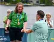 22 June 2023; Team Ireland's Breege Walsh, a member of Castlebar Special Olympics Club, from Claremorris, Mayo, as she was presented with a Bronze Medal by Matt English, CEO of Special Olympics Ireland, after the KT-1200m Woman F04 event at the Kayaking Finals on day six of the World Special Olympic Games 2023 at the Grünau regatta course in Berlin, Germany. Photo by Ray McManus/Sportsfile