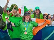 22 June 2023; Family and friends join Team Ireland's Breege Walsh, a member of Castlebar Special Olympics Club, from Claremorris, Mayo, after she was presented with a Bronze Medal after the KT-1200m Woman F04 event at the Kayaking Finals on day six of the World Special Olympic Games 2023 at the Grünau regatta course in Berlin, Germany. Photo by Ray McManus/Sportsfile