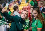 22 June 2023; Saoirse Noonan of Republic of Ireland takes selfies with supporters after the women's international friendly match between Republic of Ireland and Zambia at Tallaght Stadium in Dublin. Photo by Stephen McCarthy/Sportsfile