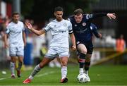 23 June 2023; Shane Griffin of Shelbourne in action against Conor Carty of St Patrick's Athletic during the SSE Airtricity Men's Premier Division match between St Patrick's Athletic and Shelbourne at Richmond Park in Dublin. Photo by Harry Murphy/Sportsfile