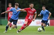 23 June 2023; David Cawley of Sligo Rovers in action against Luke O'Regan of UCD during the SSE Airtricity Men's Premier Division match between UCD and Sligo Rovers at UCD Bowl in Dublin. Photo by Stephen Marken/Sportsfile