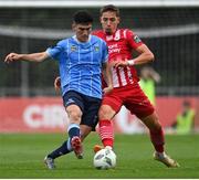 23 June 2023; Lukas Browning of Sligo Rovers in action against Brendan Barr of UCD during the SSE Airtricity Men's Premier Division match between UCD and Sligo Rovers at UCD Bowl in Dublin. Photo by Stephen Marken/Sportsfile