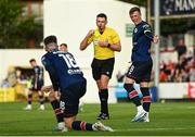 23 June 2023; Chris Forrester of St Patrick's Athletic remonstrates with teammate Ben McCormack as referee Rob Hennessy shows him a yellow card during the SSE Airtricity Men's Premier Division match between St Patrick's Athletic and Shelbourne at Richmond Park in Dublin. Photo by Harry Murphy/Sportsfile