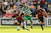 23 June 2023; Graham Burke of Shamrock Rovers in action against Grant Horton of Bohemians during the SSE Airtricity Men's Premier Division match between Bohemians and Shamrock Rovers at Dalymount Park in Dublin. Photo by Seb Daly/Sportsfile