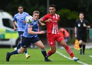23 June 2023; Jack Keaney of UCD in action against Max Mata of Sligo Rovers during the SSE Airtricity Men's Premier Division match between UCD and Sligo Rovers at UCD Bowl in Dublin. Photo by Stephen Marken/Sportsfile