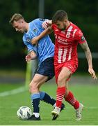 23 June 2023; Alex Nolan of UCD in action against Frank Liivak of Sligo Rovers during the SSE Airtricity Men's Premier Division match between UCD and Sligo Rovers at UCD Bowl in Dublin. Photo by Stephen Marken/Sportsfile