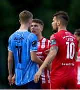 23 June 2023; Alex Nolan of UCD exchanges words with Kailin Barlow of Sligo Rovers during the SSE Airtricity Men's Premier Division match between UCD and Sligo Rovers at UCD Bowl in Dublin. Photo by Stephen Marken/Sportsfile