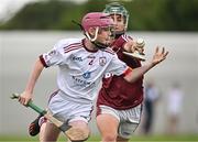 24 June 2023; Michael Barrett of St Mary's Athenry, Galway, in action against Robert Fox of Raheny, Dublin, during the John West Féile na nGael National Camogie and Hurling Finals 2023 at the Connacht GAA Centre in Bekan, Mayo. Eighty club sides took part in the national finals across seven venues in Connacht. Sponsored for the eighth time by John West, it is one of the biggest underage sporting events on the continent. Photo by Sam Barnes/Sportsfile