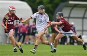 24 June 2023; Cian Hannon of St Mary's Athenry, Galway, in action against Sean Thunder, left, and  Andrew Fox of Raheny, Dublin, during the John West Féile na nGael National Camogie and Hurling Finals 2023 at the Connacht GAA Centre in Bekan, Mayo. Eighty club sides took part in the national finals across seven venues in Connacht. Sponsored for the eighth time by John West, it is one of the biggest underage sporting events on the continent. Photo by Sam Barnes/Sportsfile