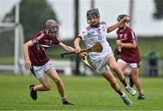 24 June 2023; Cian Hannon of St Mary's Athenry, Galway, in action against Thomas Judge of Raheny, Dublin, during the John West Féile na nGael National Camogie and Hurling Finals 2023 at the Connacht GAA Centre in Bekan, Mayo. Eighty club sides took part in the national finals across seven venues in Connacht. Sponsored for the eighth time by John West, it is one of the biggest underage sporting events on the continent. Photo by Sam Barnes/Sportsfile
