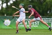 24 June 2023; Niall McCarthy of St Mary's Athenry, Galway, in action against Andrew Fox of Raheny, Dublin, during the John West Féile na nGael National Camogie and Hurling Finals 2023 at the Connacht GAA Centre in Bekan, Mayo. Eighty club sides took part in the national finals across seven venues in Connacht. Sponsored for the eighth time by John West, it is one of the biggest underage sporting events on the continent. Photo by Sam Barnes/Sportsfile