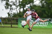 24 June 2023; Niall McCarthy of St Mary's Athenry, Galway, in action against Andrew Fox of Raheny, Dublin, during the John West Féile na nGael National Camogie and Hurling Finals 2023 at the Connacht GAA Centre in Bekan, Mayo. Eighty club sides took part in the national finals across seven venues in Connacht. Sponsored for the eighth time by John West, it is one of the biggest underage sporting events on the continent. Photo by Sam Barnes/Sportsfile