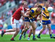 24 June 2023; Dylan Ruane of Roscommon is tackled by Ruairí Deane of Cork during the GAA Football All-Ireland Senior Championship Preliminary Quarter Final match between Cork and Roscommon at Páirc Uí Chaoimh in Cork. Photo by Tom Beary/Sportsfile
