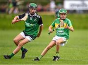 24 June 2023; Aaron Screeney of Kilcormac Killoughey in action against Joel Barr of Castlewellan during the John West Féile na nGael at Connacht GAA Centre of Excellence in Bekan, Mayo. Photo by Stephen Marken/Sportsfile