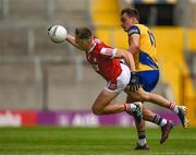 24 June 2023; Tommy Walsh of Cork is tackled by Enda Smith of Roscommon during the GAA Football All-Ireland Senior Championship Preliminary Quarter Final match between Cork and Roscommon at Páirc Uí Chaoimh in Cork. Photo by Tom Beary/Sportsfile