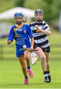 24 June 2023; Lily Fahy of Newmarket on Fergus in action against Leah Barrett of Turloughmore during the John West Féile na nGael at Connacht GAA Centre of Excellence in Bekan, Mayo. Photo by Stephen Marken/Sportsfile