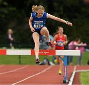 24 June 2023; Caoimhe Flannery, from Skibbereen SS, Munster, jumps the last steeplechase barrier before winning the Girls 1500m Steeplechase during the 123.ie Tailteann School’s Interprovincial Games at the SETU Campus in Carlow. Photo by Matt Browne/Sportsfile