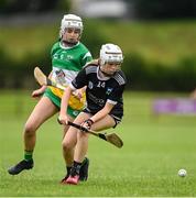 24 June 2023; Hazel Horgan of Newcastle West in action against Jenny Nolan of Duffry Rovers during the John West Féile na nGael at Connacht GAA Centre of Excellence in Bekan, Mayo. Photo by Stephen Marken/Sportsfile