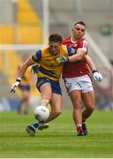 24 June 2023; Dylan Ruane of Roscommon is tackled by Sean Powter of Cork during the GAA Football All-Ireland Senior Championship Preliminary Quarter Final match between Cork and Roscommon at Páirc Uí Chaoimh in Cork. Photo by Tom Beary/Sportsfile