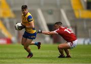 24 June 2023; Conor Daly of Roscommon is tackled by Sean Powter of Cork during the GAA Football All-Ireland Senior Championship Preliminary Quarter Final match between Cork and Roscommon at Páirc Uí Chaoimh in Cork. Photo by Tom Beary/Sportsfile