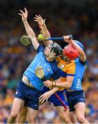 24 June 2023; Danny Sutcliffe of Dublin and his teammate Paul Crummey try and catch the sliothar ahead of Darragh Lohan of Clare during the GAA Hurling All-Ireland Senior Championship Quarter Final match between Clare and Dublin at TUS Gaelic Grounds in Limerick. Photo by Ray McManus/Sportsfile