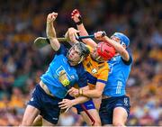 24 June 2023; Danny Sutcliffe of Dublin and his teammate Paul Crummey fail to catch the sliothar ahead of Darragh Lohan of Clare during the GAA Hurling All-Ireland Senior Championship Quarter Final match between Clare and Dublin at TUS Gaelic Grounds in Limerick. Photo by Ray McManus/Sportsfile