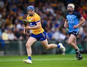 24 June 2023; Shane O'Donnell of Clare gets past Mark Grogan of Dublin on his way to scoring his side's fourth goal during the GAA Hurling All-Ireland Senior Championship Quarter Final match between Clare and Dublin at TUS Gaelic Grounds in Limerick. Photo by Piaras Ó Mídheach/Sportsfile