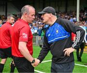 24 June 2023; Referee Johnny Murphy, left, and Clare hurling manager Brian Lohan, shake hands after the GAA Hurling All-Ireland Senior Championship Quarter Final match between Clare and Dublin at TUS Gaelic Grounds in Limerick. Photo by Ray McManus/Sportsfile