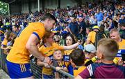 24 June 2023; Tony Kelly of Clare with young supporters after the GAA Hurling All-Ireland Senior Championship Quarter Final match between Clare and Dublin at TUS Gaelic Grounds in Limerick. Photo by Ray McManus/Sportsfile