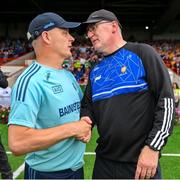 24 June 2023; The two managers, Dublin manager Micheál Donoghue and Clare hurling manager Brian Lohan, shake hands after the GAA Hurling All-Ireland Senior Championship Quarter Final match between Clare and Dublin at TUS Gaelic Grounds in Limerick. Photo by Ray McManus/Sportsfile