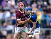 24 June 2023; Alan Tynan of Tipperary and Ronan Glennon of Galway tussle early in the first half during the GAA Hurling All-Ireland Senior Championship Quarter Final match between Galway and Tipperary at TUS Gaelic Grounds in Limerick. Photo by Piaras Ó Mídheach/Sportsfile