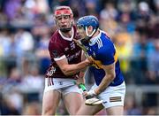 24 June 2023; Alan Tynan of Tipperary and Ronan Glennon of Galway tussle early in the first half during the GAA Hurling All-Ireland Senior Championship Quarter Final match between Galway and Tipperary at TUS Gaelic Grounds in Limerick. Photo by Piaras Ó Mídheach/Sportsfile