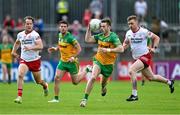 24 June 2023; Eoghan Ban Gallagher of Donegal in action against Kieran McGeary and Michael O’Neill of Tyrone during the GAA Football All-Ireland Senior Championship Preliminary Quarter Final match between Donegal and Tyrone at MacCumhaill Park in Ballybofey, Donegal. Photo by Brendan Moran/Sportsfile