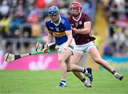 24 June 2023; Alan Tynan of Tipperary in action against Ronan Glennon of Galway during the GAA Hurling All-Ireland Senior Championship Quarter Final match between Galway and Tipperary at TUS Gaelic Grounds in Limerick. Photo by Piaras Ó Mídheach/Sportsfile