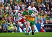24 June 2023; Patrick McBrearty of Donegal is tackled by Ronan McNamee of Tyrone during the GAA Football All-Ireland Senior Championship Preliminary Quarter Final match between Donegal and Tyrone at MacCumhaill Park in Ballybofey, Donegal. Photo by Brendan Moran/Sportsfile