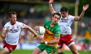 24 June 2023; Hugh McFadden of Donegal in action against Kieran McGeary, left, and Michael McKernan of Tyrone during the GAA Football All-Ireland Senior Championship Preliminary Quarter Final match between Donegal and Tyrone at MacCumhaill Park in Ballybofey, Donegal. Photo by Brendan Moran/Sportsfile