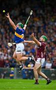 24 June 2023; Cathal Barrett of Tipperary wins possession of the sliotar ahead of Brian Concannon of Galway during the GAA Hurling All-Ireland Senior Championship Quarter Final match between Galway and Tipperary at TUS Gaelic Grounds in Limerick. Photo by Ray McManus/Sportsfile