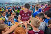 24 June 2023; Cianan Fahy of Galway signs autographs after the GAA Hurling All-Ireland Senior Championship Quarter Final match between Galway and Tipperary at TUS Gaelic Grounds in Limerick. Photo by Ray McManus/Sportsfile