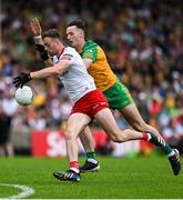 24 June 2023; Brian Kennedy of Tyrone in action against Jason McGee of Donegal during the GAA Football All-Ireland Senior Championship Preliminary Quarter Final match between Donegal and Tyrone at MacCumhaill Park in Ballybofey, Donegal. Photo by Brendan Moran/Sportsfile