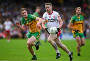 24 June 2023; Michael O’Neill of Tyrone in action against Ciaran Thompson of Donegal during the GAA Football All-Ireland Senior Championship Preliminary Quarter Final match between Donegal and Tyrone at MacCumhaill Park in Ballybofey, Donegal. Photo by Brendan Moran/Sportsfile