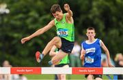 24 June 2023; Matei Ursachi, from St Pauls Raheny, Leinster, jumps the last steeplechase barrier on his way to winning the Boys 1500m during the 123.ie Tailteann School’s Interprovincial Games at the SETU Campus in Carlow. Photo by Matt Browne/Sportsfile