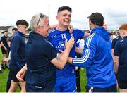 24 June 2023; Gary Mohan of Monaghan, and manager Vinny Corey, right, celebrate with supporters after their side's victory in the GAA Football All-Ireland Senior Championship Preliminary Quarter Final match between Kildare and Monaghan at Glenisk O'Connor Park in Tullamore, Offaly. Photo by Seb Daly/Sportsfile
