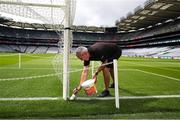 25 June 2023; Groundsman Declan Magee prepares the pitch before the Tailteann Cup Semi Final match between Down and Laois at Croke Park in Dublin. Photo by Michael P Ryan/Sportsfile