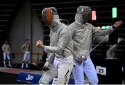 25 June 2023; Jadryn Dick of Ireland, left, celebrates a point against Krzysztof Kaczkowski of Poland in the Fencing men's sabre individual match at the Tauron Arena during the European Games 2023 in Krakow, Poland. Photo by David Fitzgerald/Sportsfile