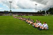 25 June 2023; Meath and Waterford players have a sit down protest before the TG4 Ladies Football All-Ireland Championship match between Waterford and Meath at Fraher Field in Dungarvan, Waterford. Photo by Matt Browne/Sportsfile